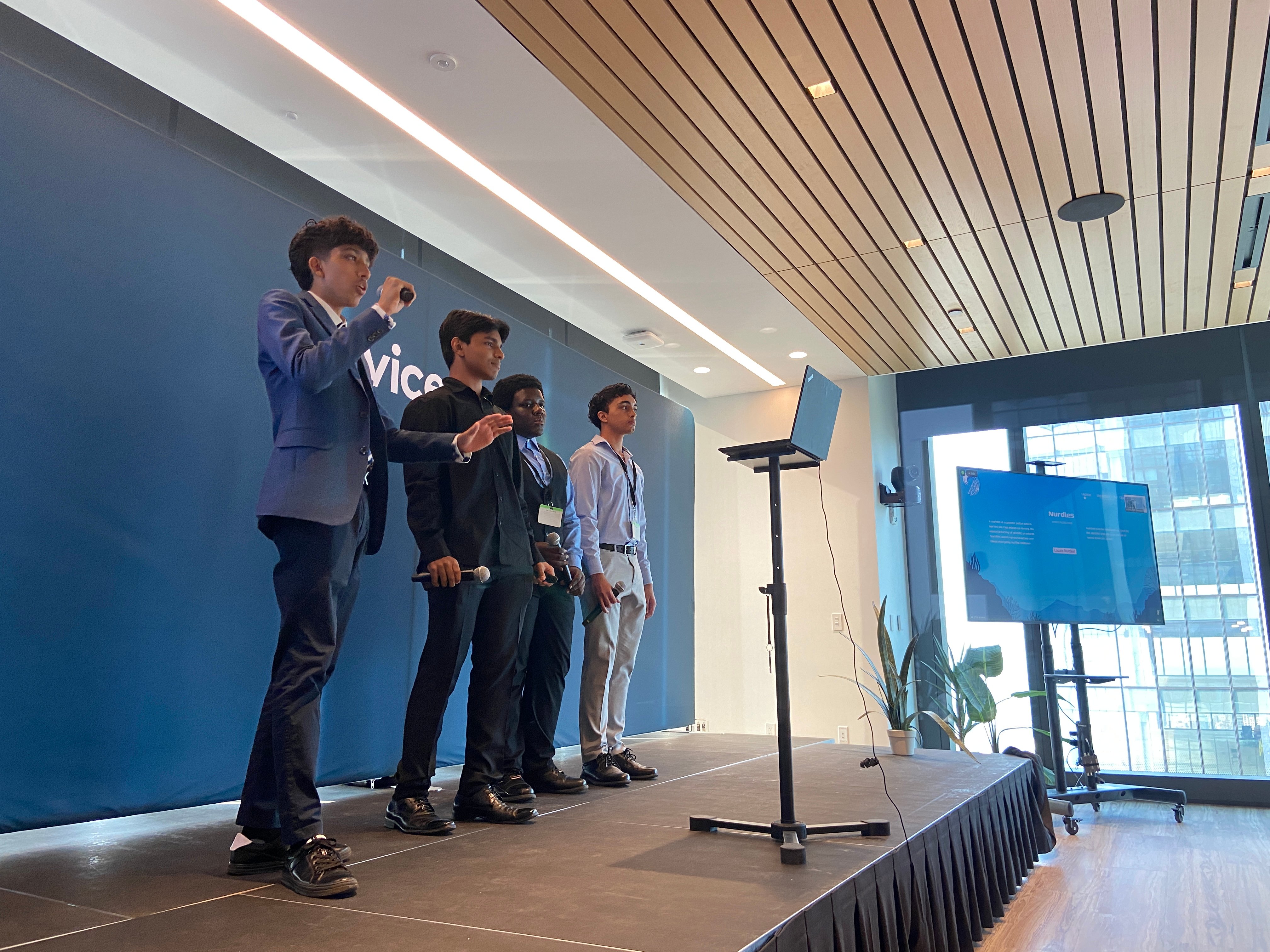 A Scholar presenting on stage at Demo Day 2024, ServiceNow headquarters, New York City